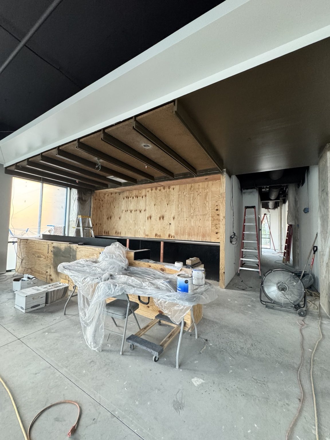 Bar painting and cleanup progress at Libations