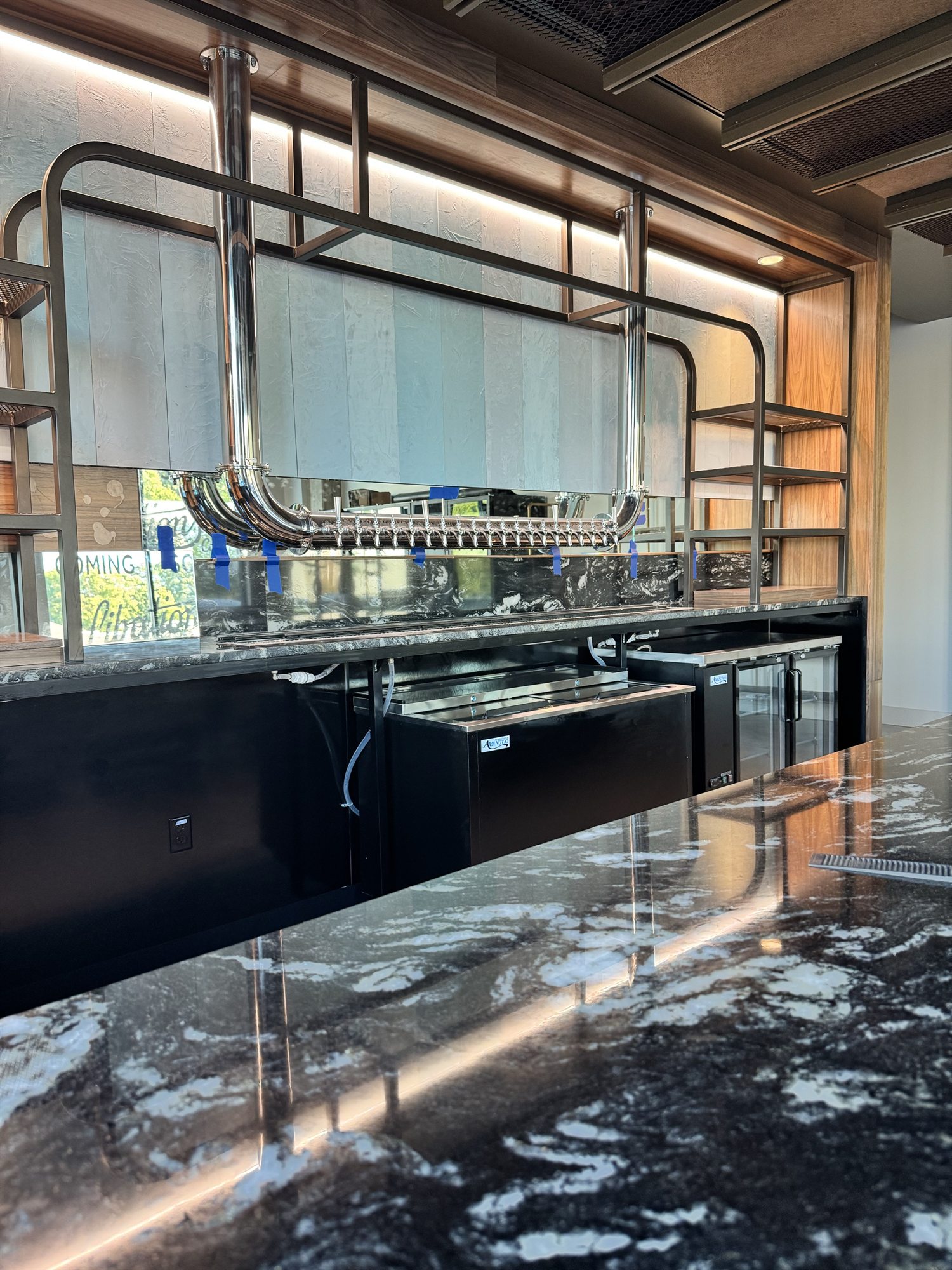 New back bar millwork and suspended tap tower installed at Libations